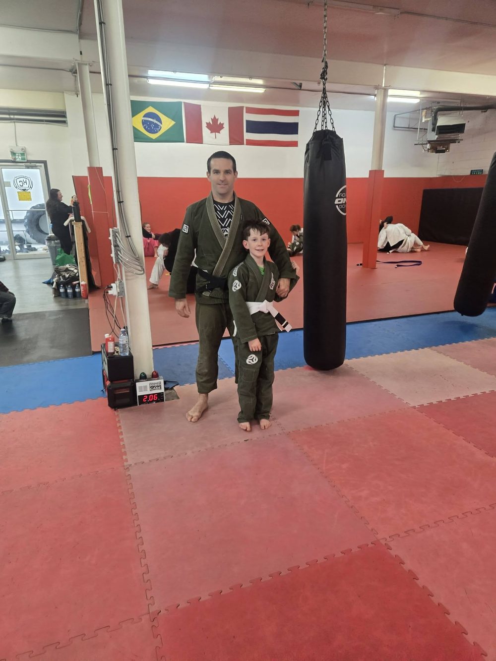 Coach Kevin Henry with a young student
