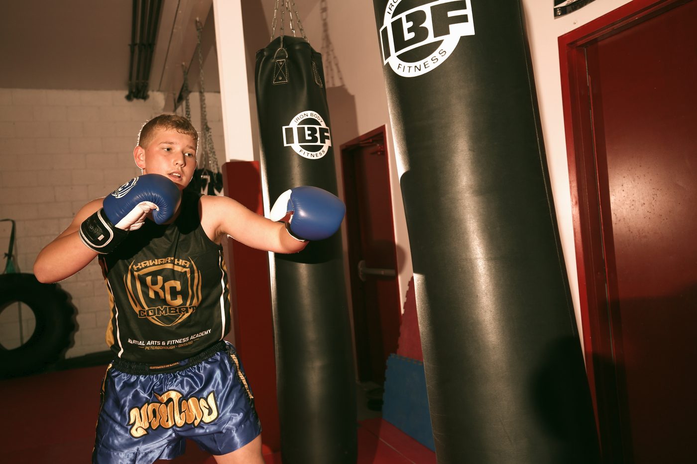 Muay Thai student hitting the heavy bag