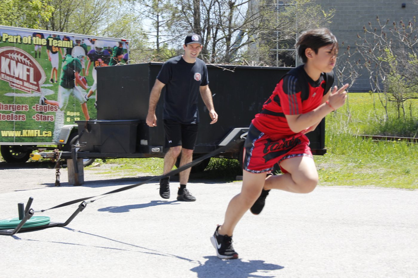Athlete sprinting with a resistance harness
